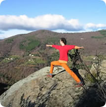Alex doing 'warrior' posture on 'the rock' - ten minutes walk from The Sun Centre.